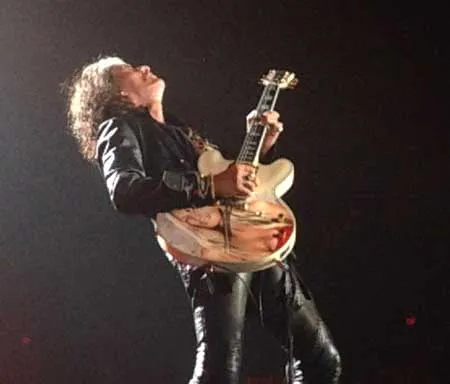 guitar player plays guitar riff